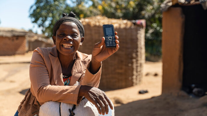 Lucia receiving her payments in Malawi