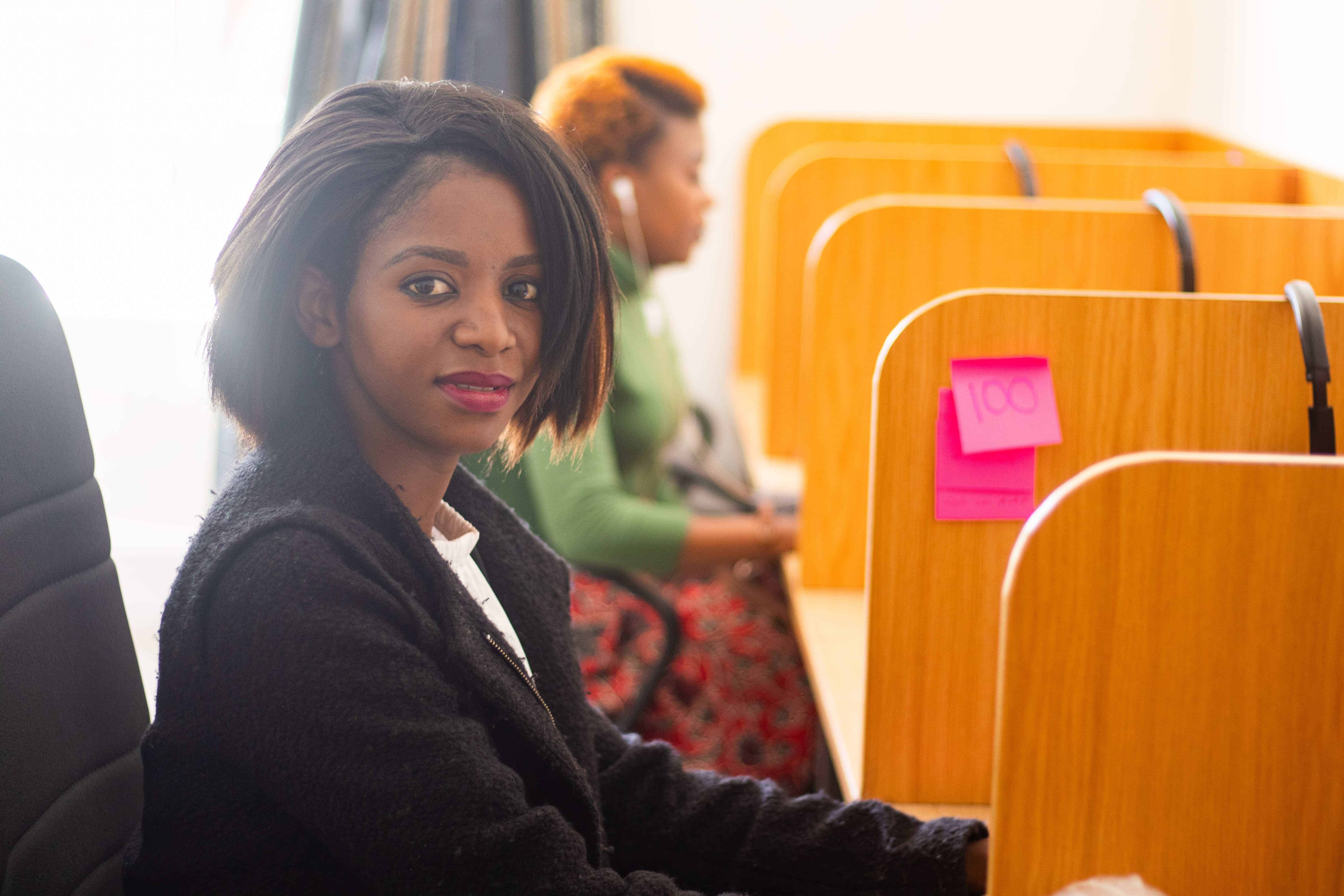 Woman sitting at Malawi call center