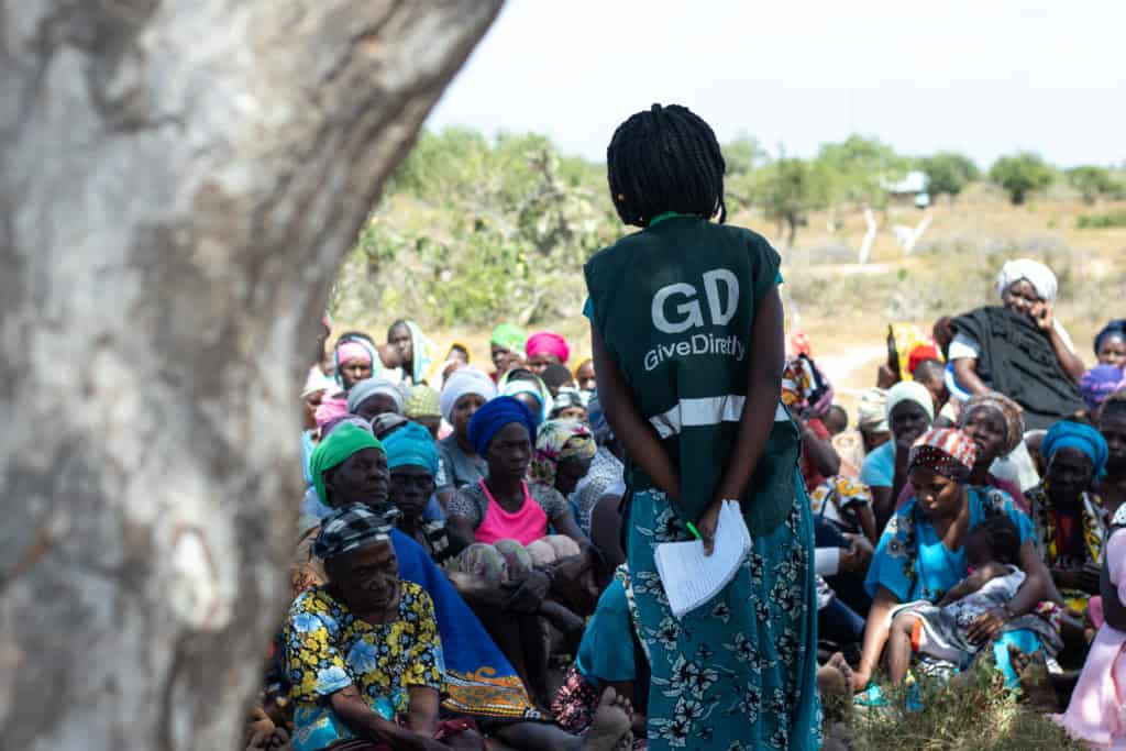 GiveDirectly staff and recipients at a baraza 