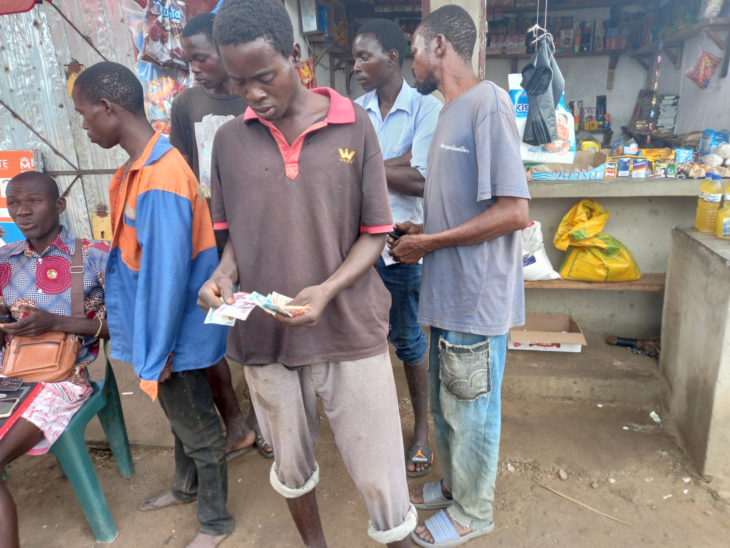 Lucas recieving a cash transfer in Nhamatanda, Mozambique